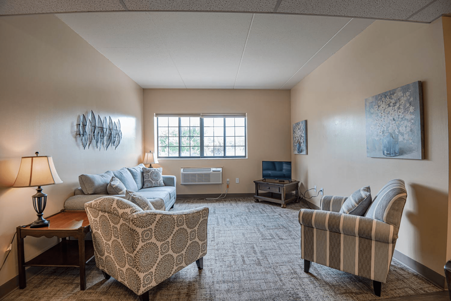 Cozy common area with seating and window light