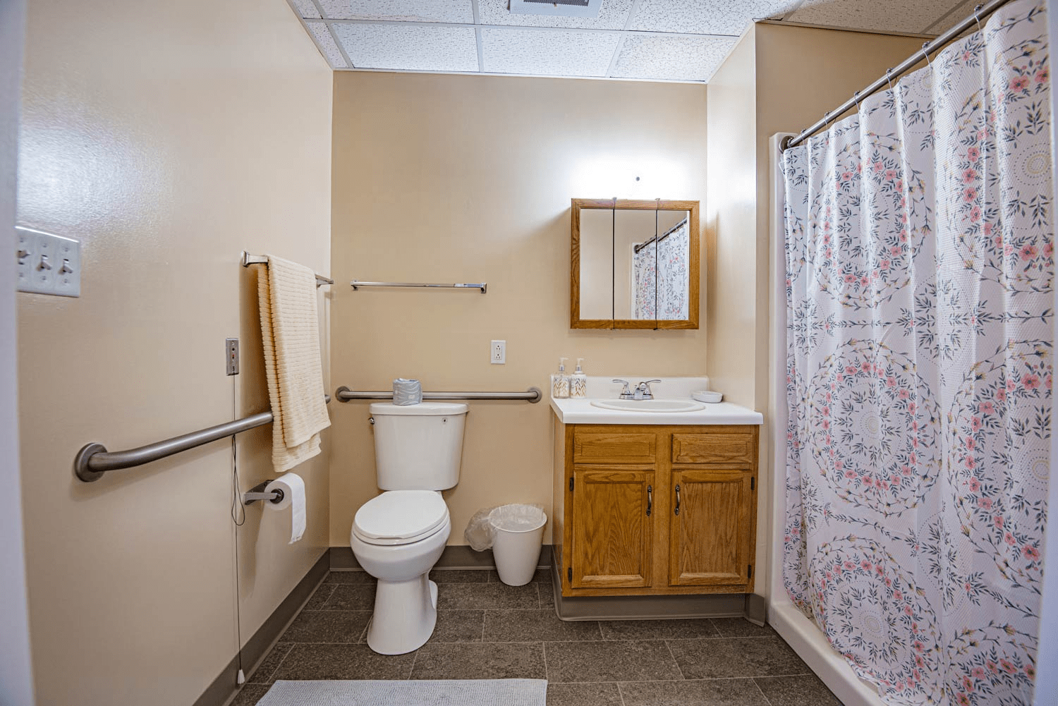 Clean bathroom with shower and sink