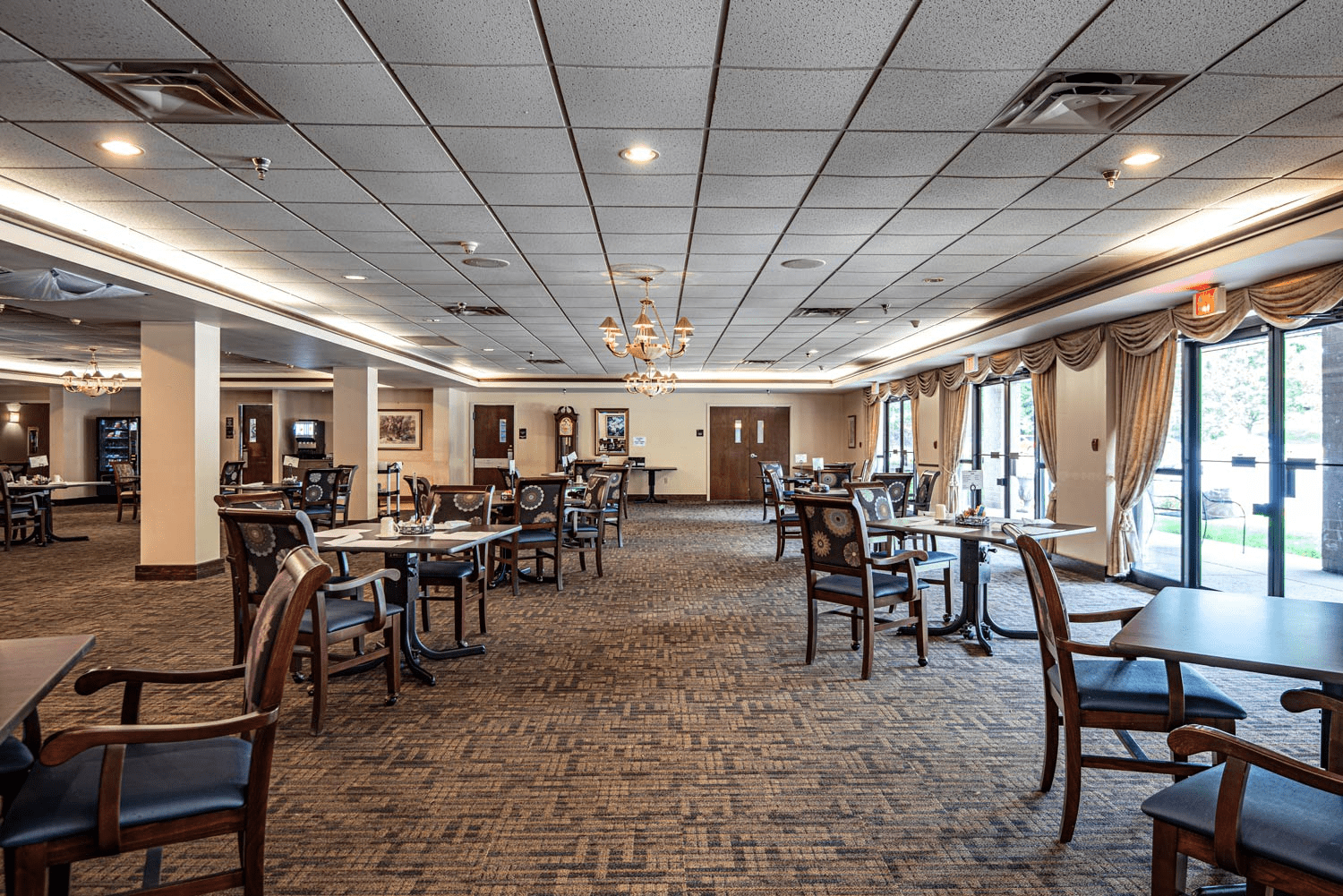 Dining area with tables and chairs.