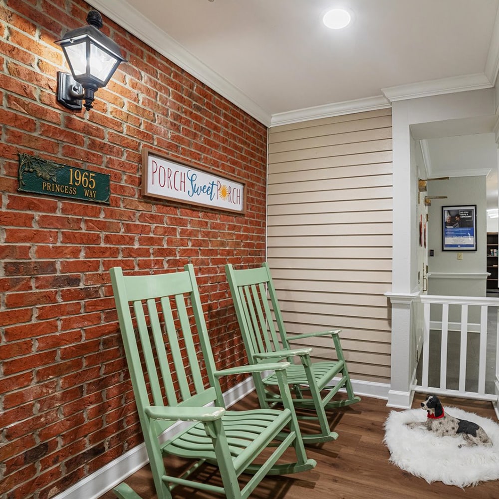 Cozy common area with rocking chairs and decor.