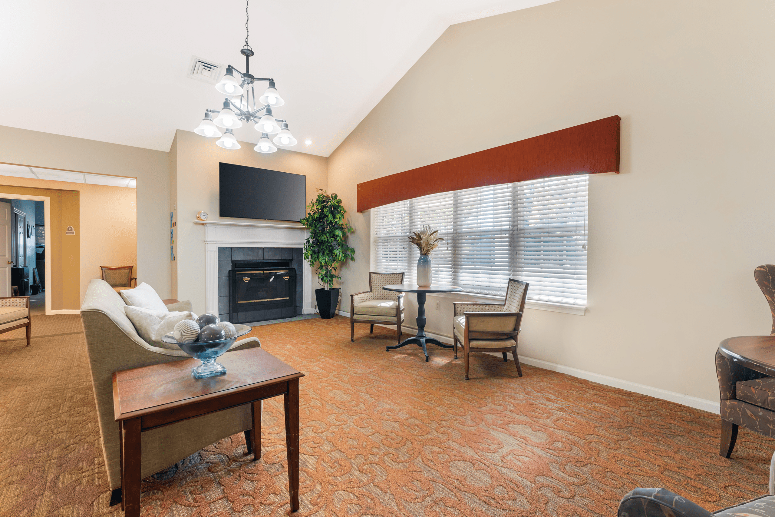 Cozy common area with seating and a fireplace.
