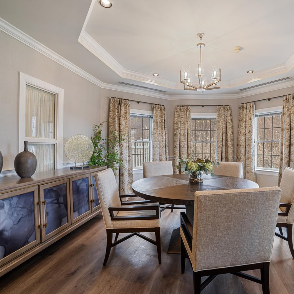 Bright interior space with a round dining table.