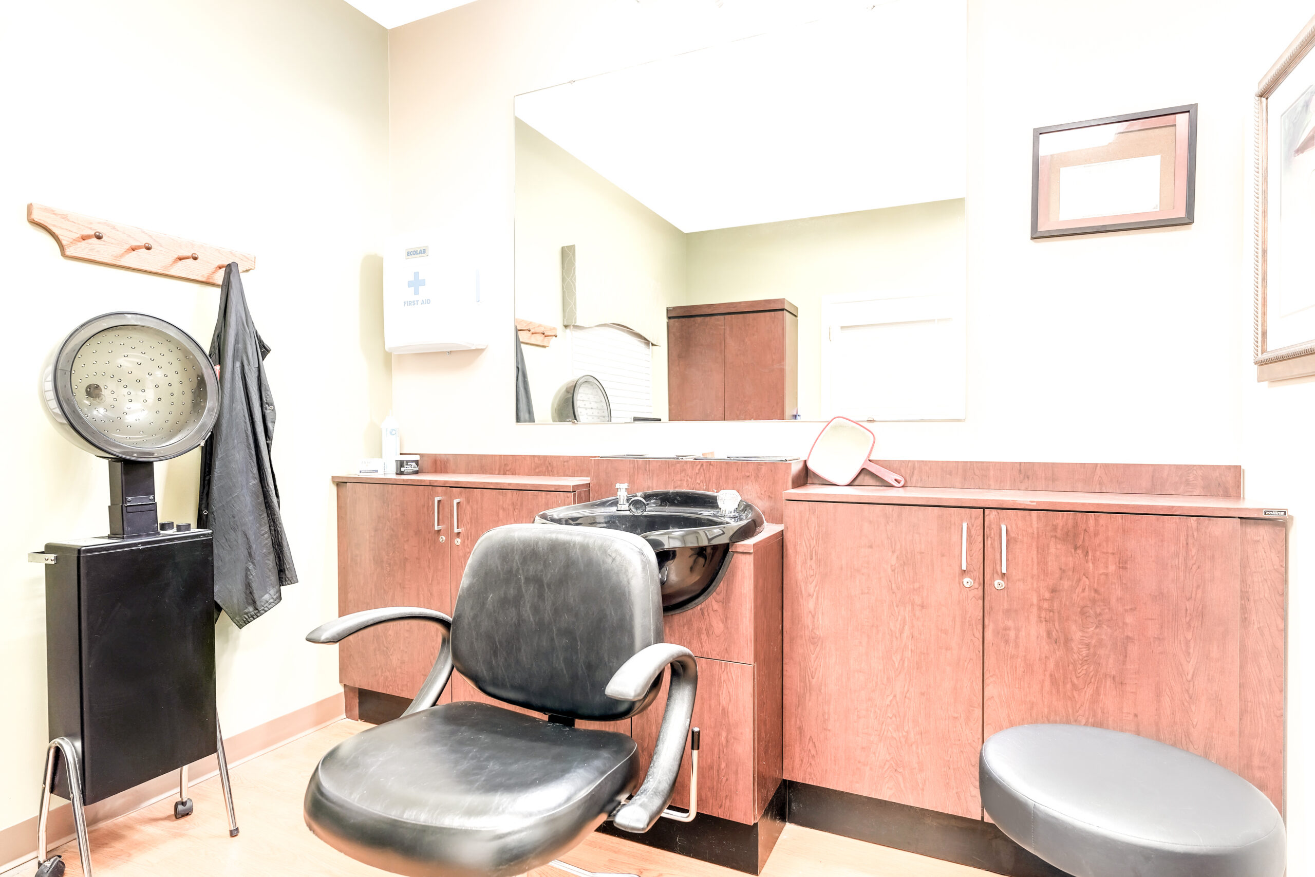 Hair salon area with chair and sink