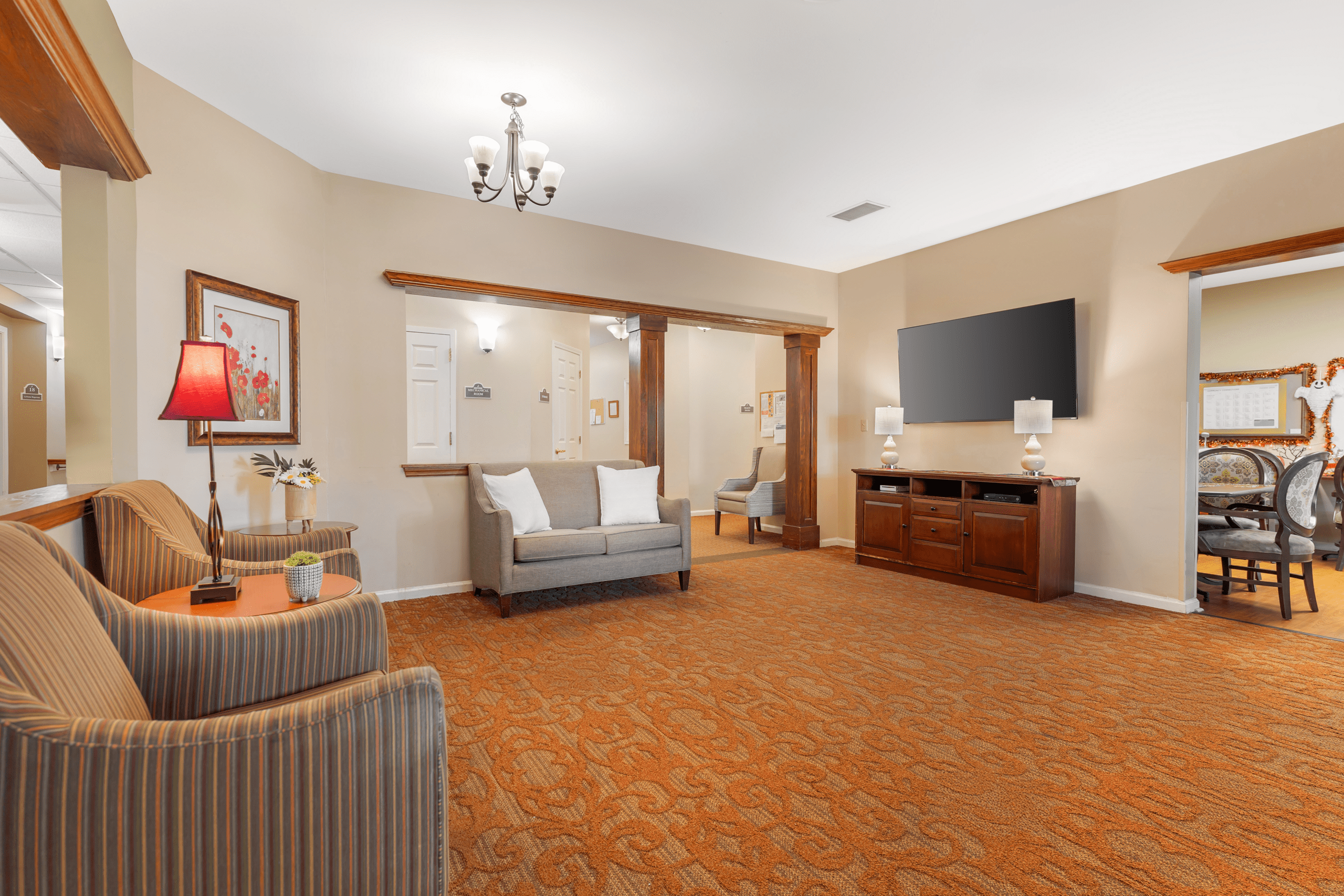 Comfortable common area with seating and a television