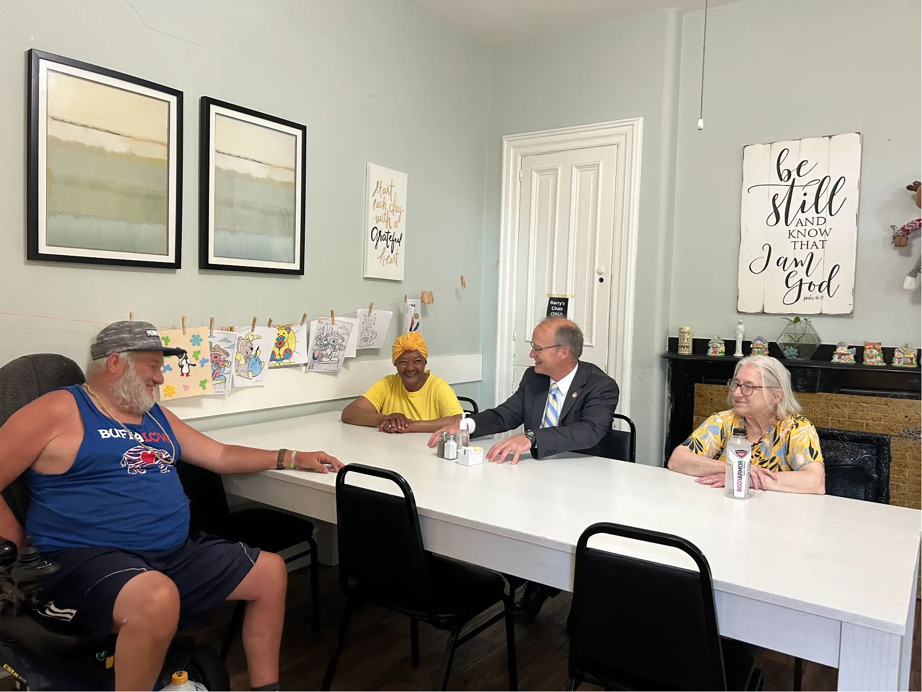 Residents and staff interacting in a common area.