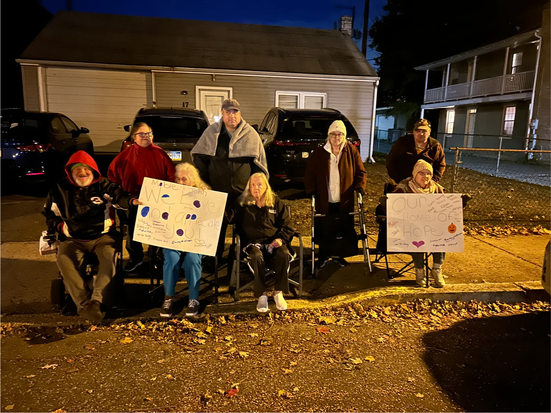 Residents holding signs outdoors