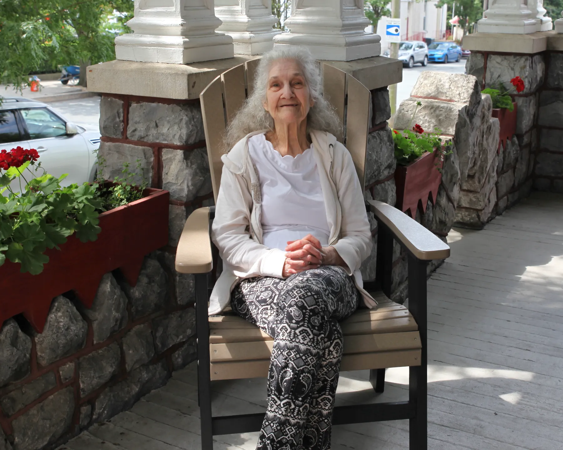 Senior woman relaxing in an outdoor chair