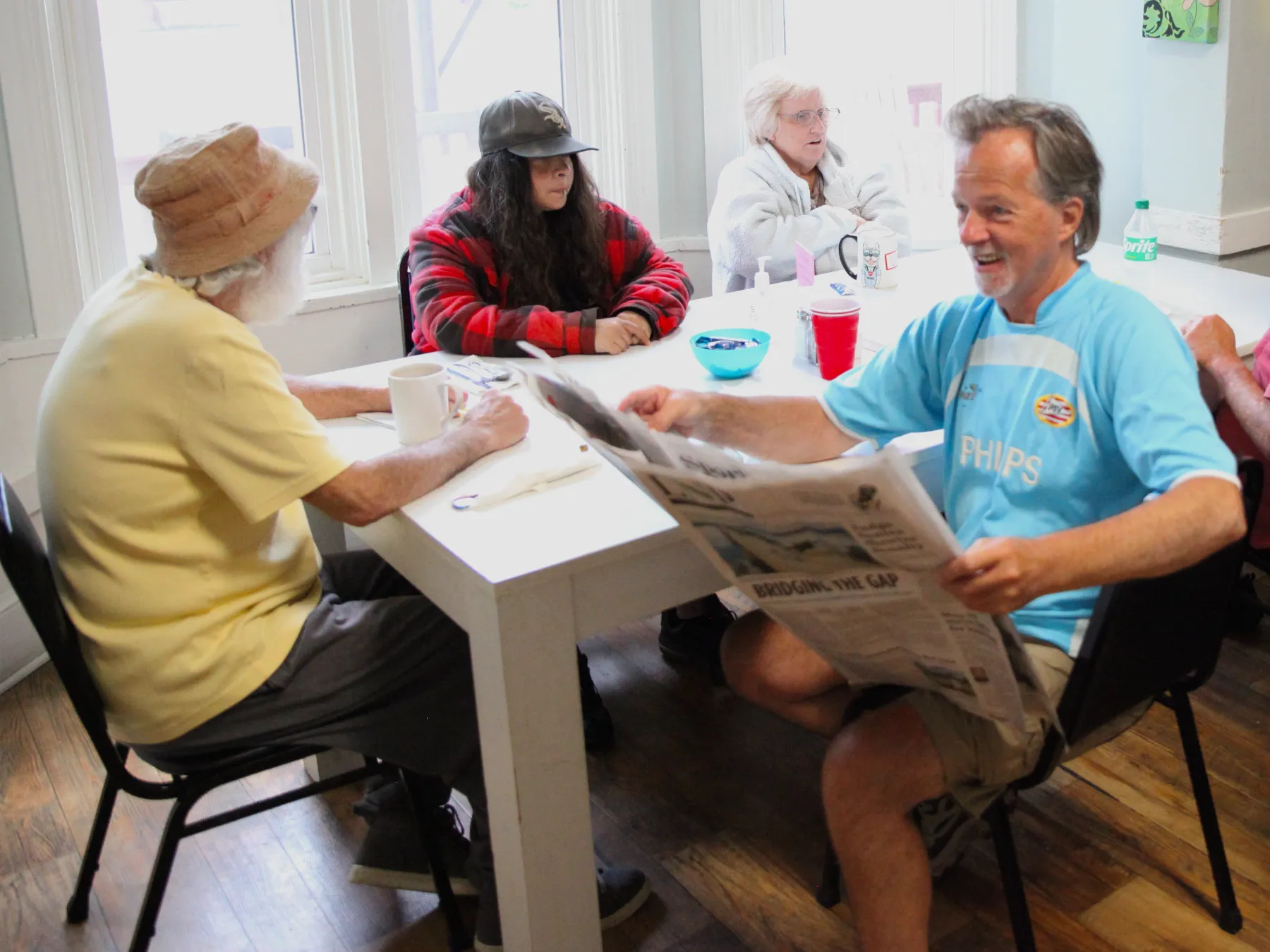 Residents engaged in activity at a table