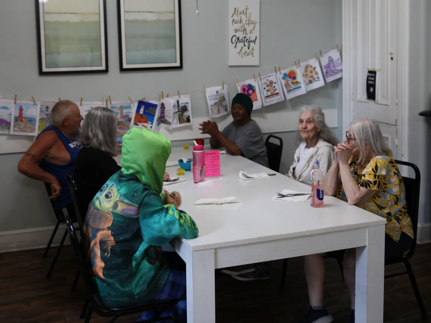 Residents enjoying a social activity at a table