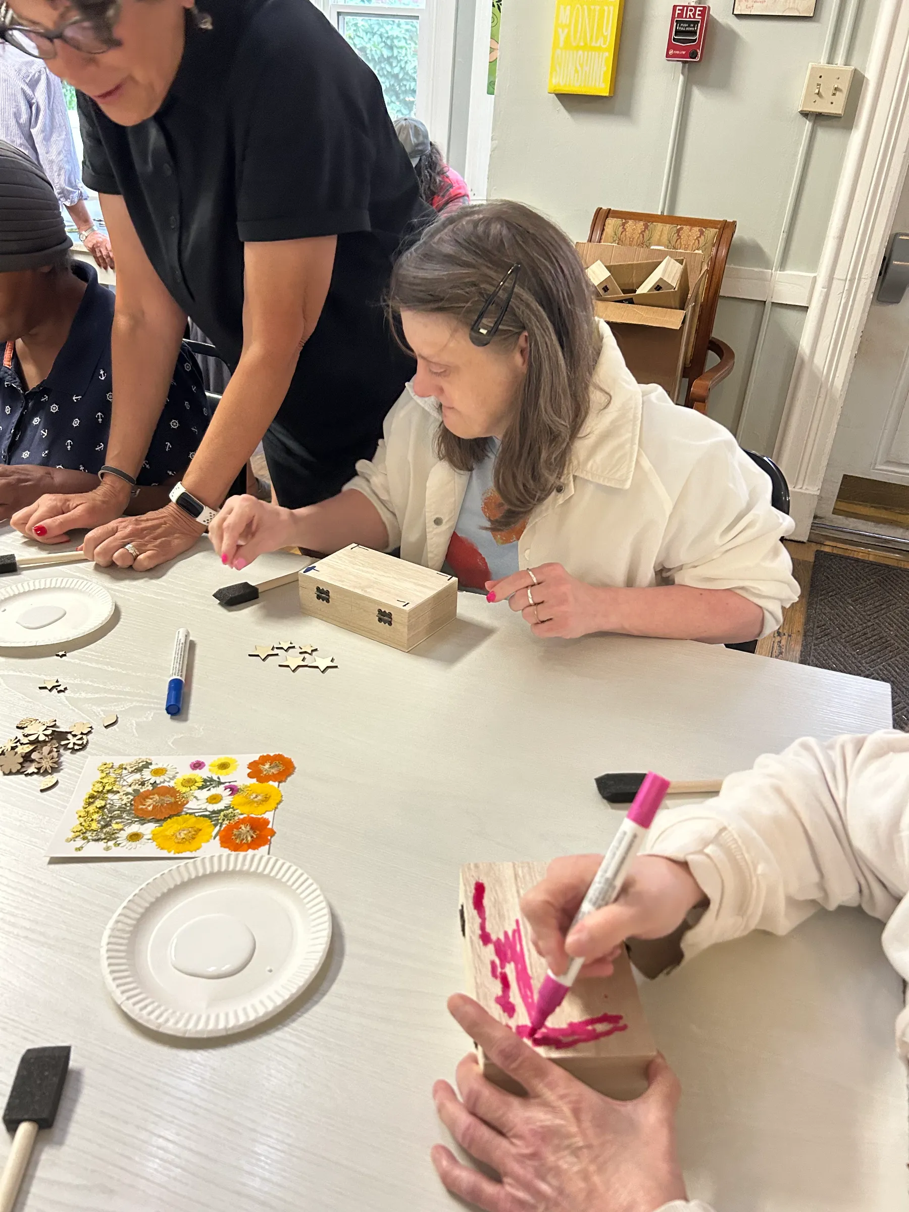 Residents engaging in a crafting activity together.