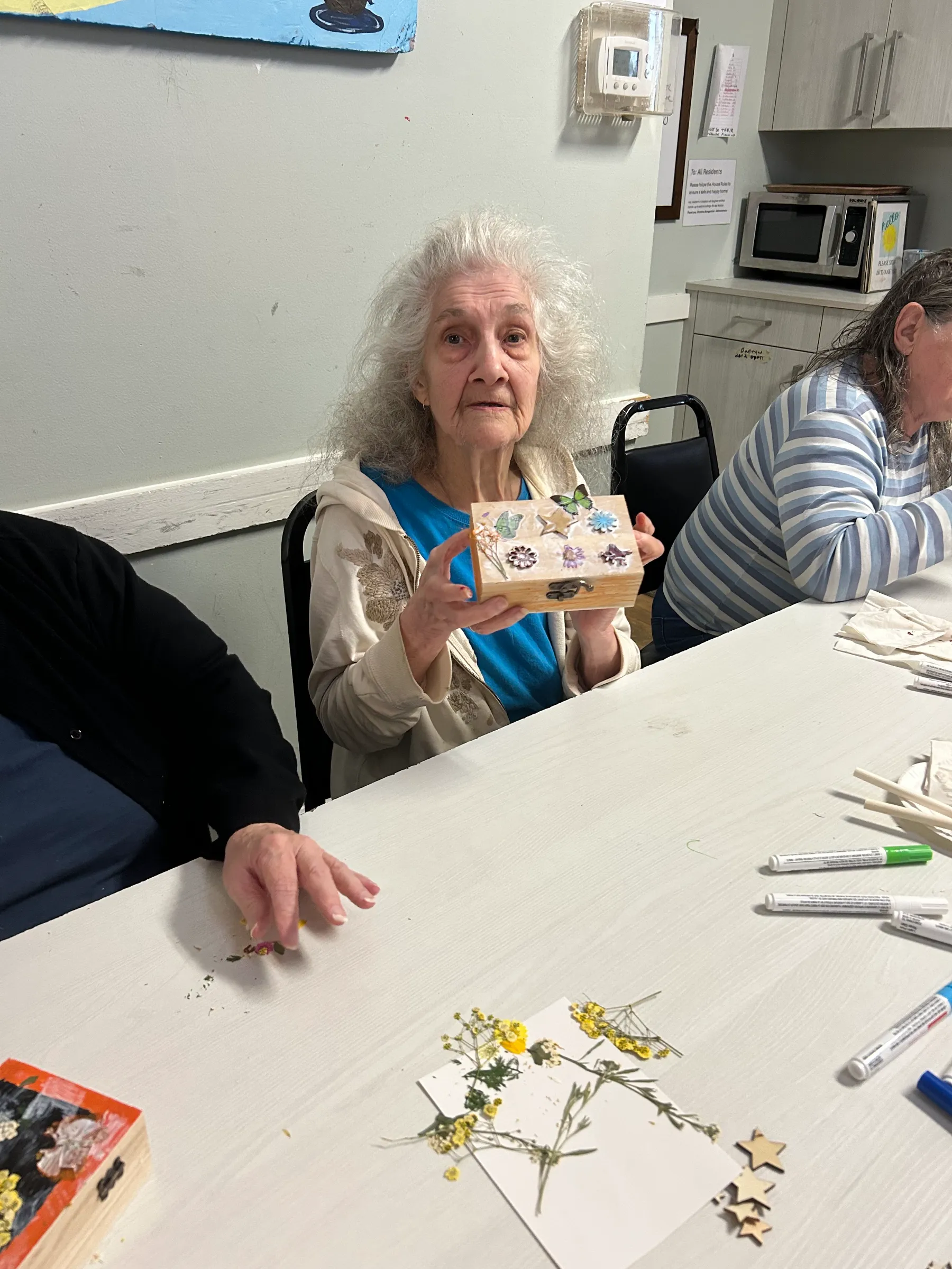 Senior resident participating in a crafting activity.