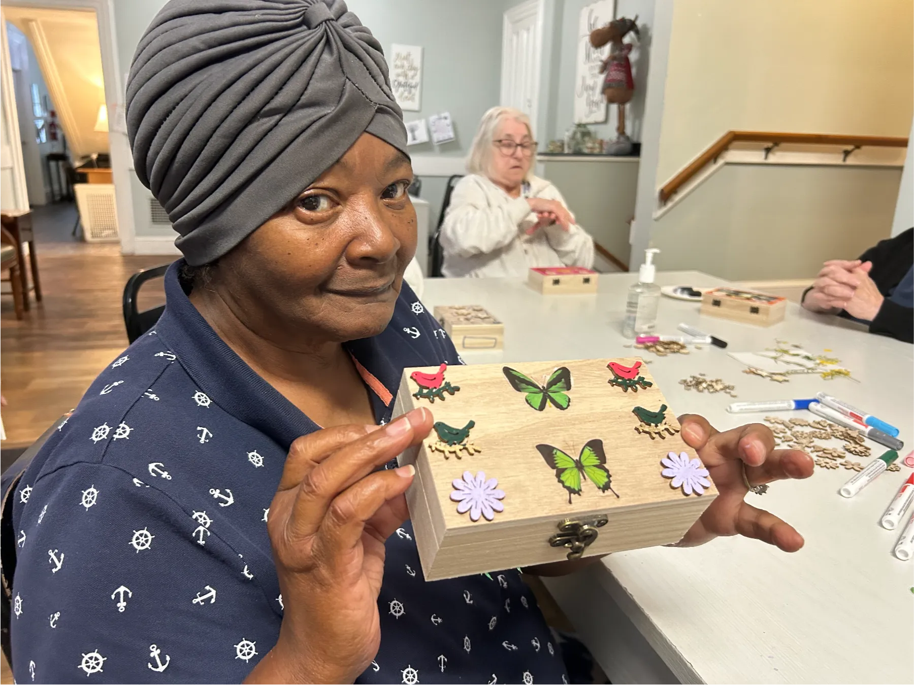 Resident engaged in a craft activity.