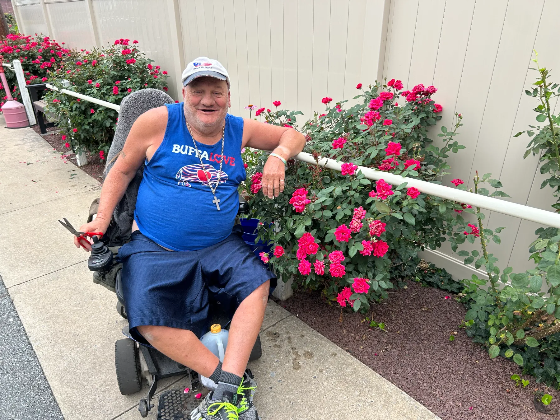 Resident enjoying the garden with roses