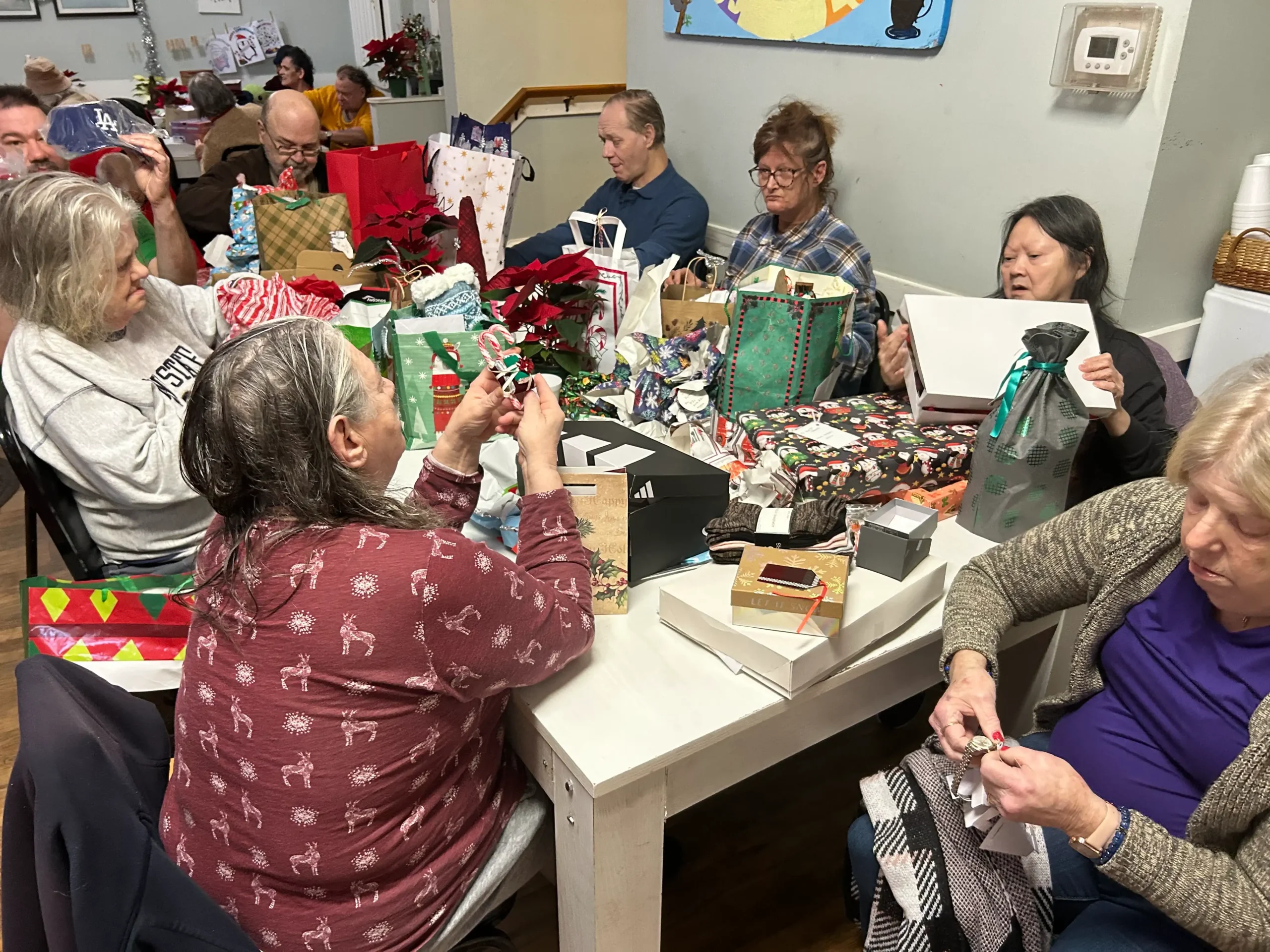 Residents enjoying a gift-wrapping activity together.