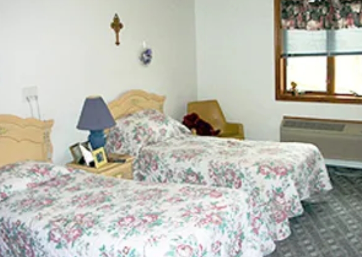Cozy shared resident room with floral bedding