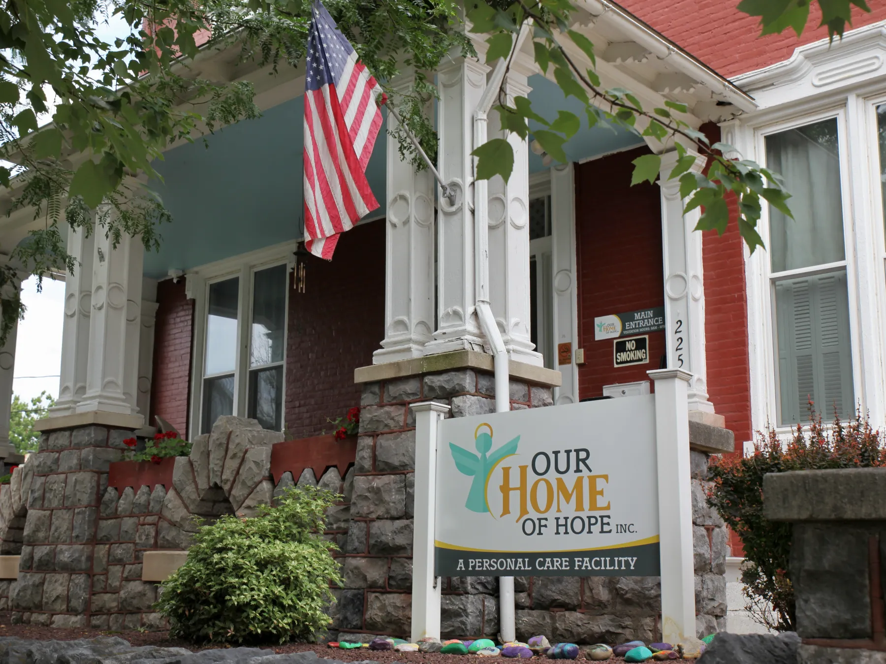 Exterior view of Our Home of Hope with flag.