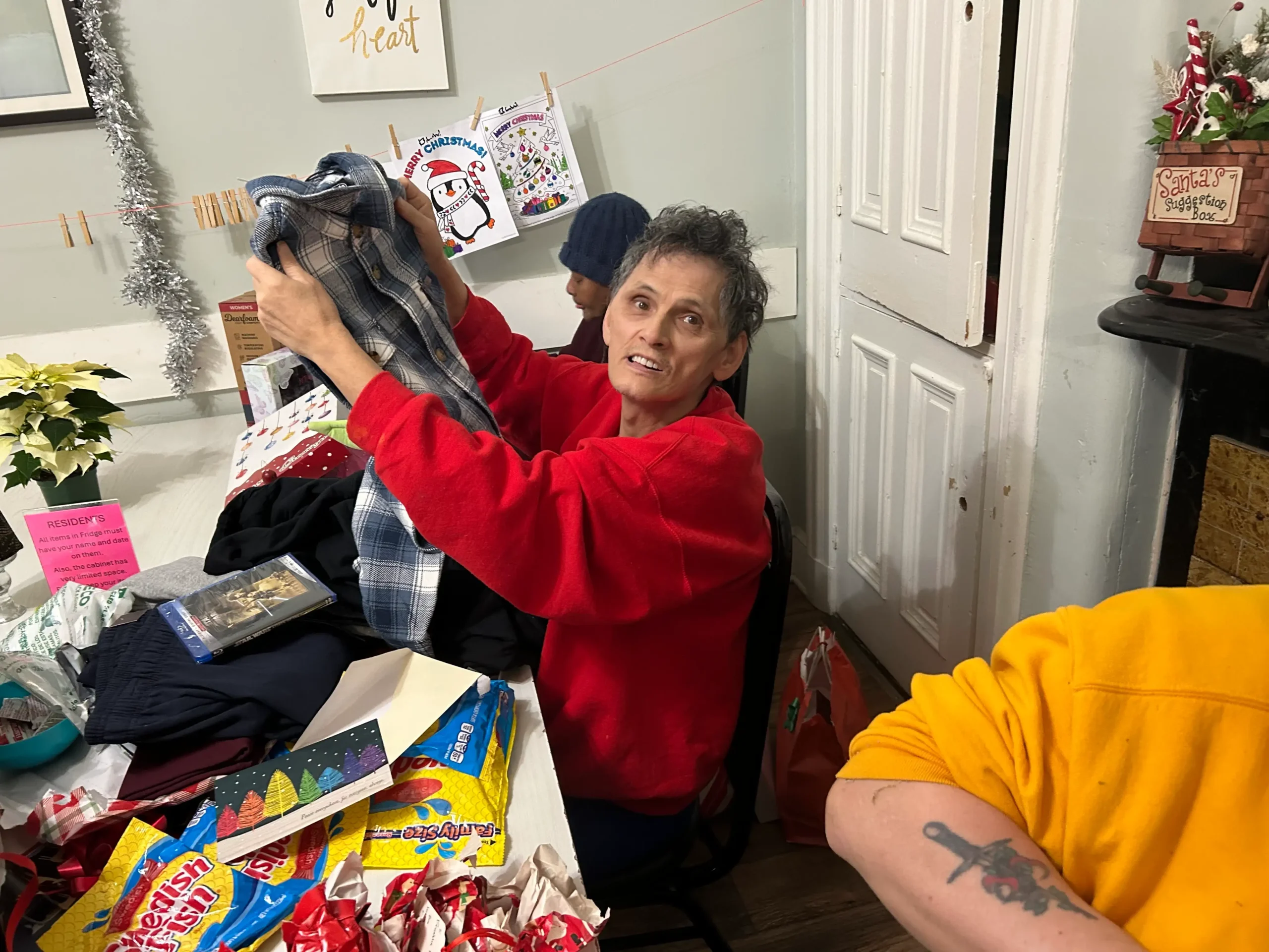 Resident happily receiving gifts during an event