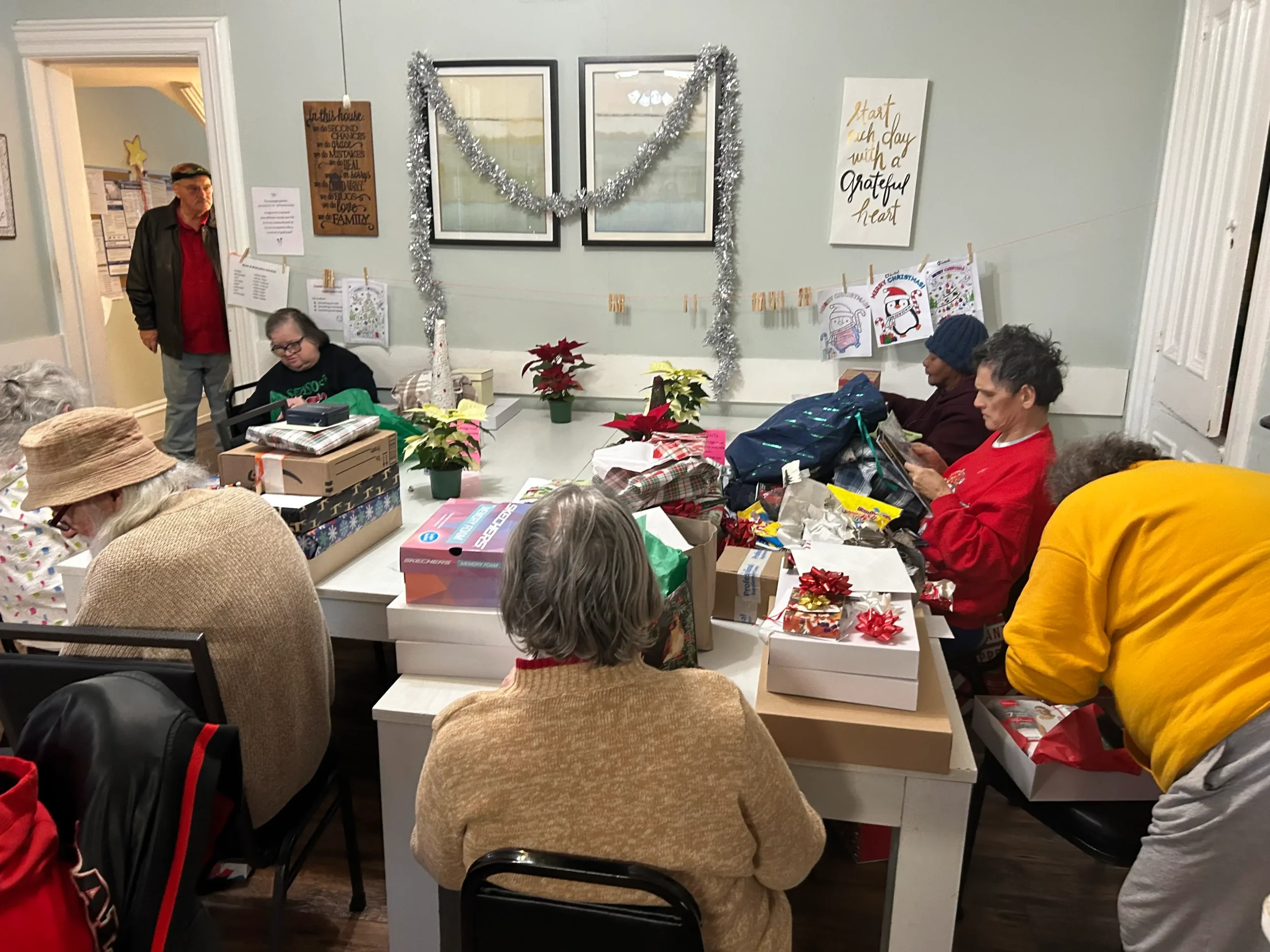Residents engaged in gift-wrapping activity.