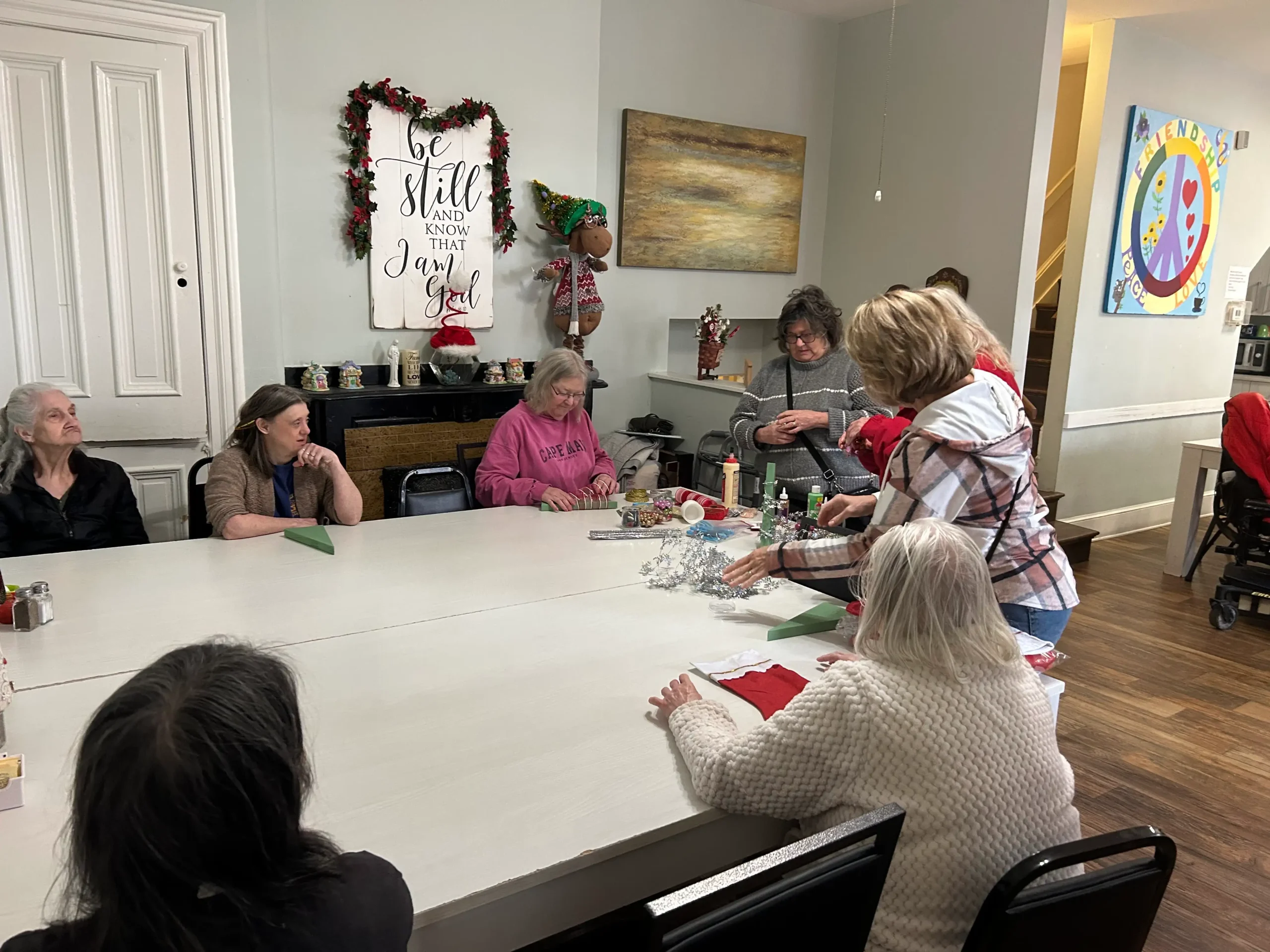 Residents participating in a craft activity indoors.