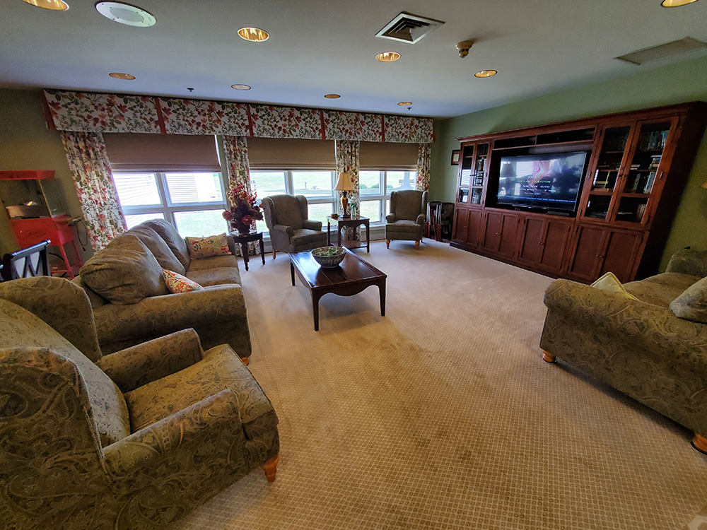 Cozy common area with seating and television.