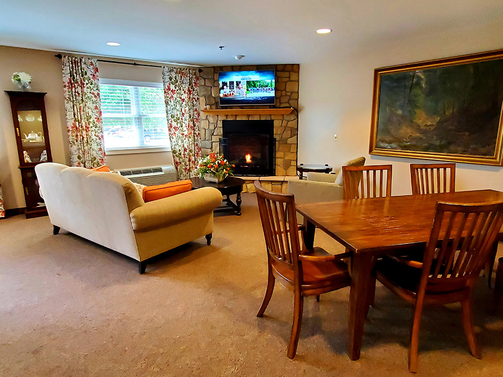 Cozy common area with seating and a fireplace