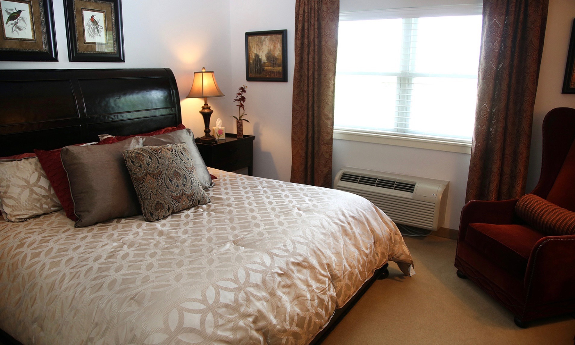 Cozy bedroom with a bed and armchair