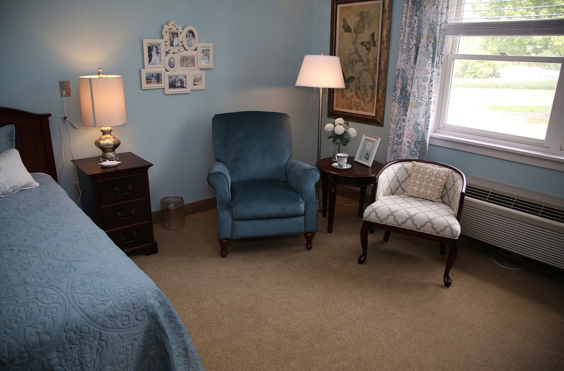 Cozy resident room with seating and decor.