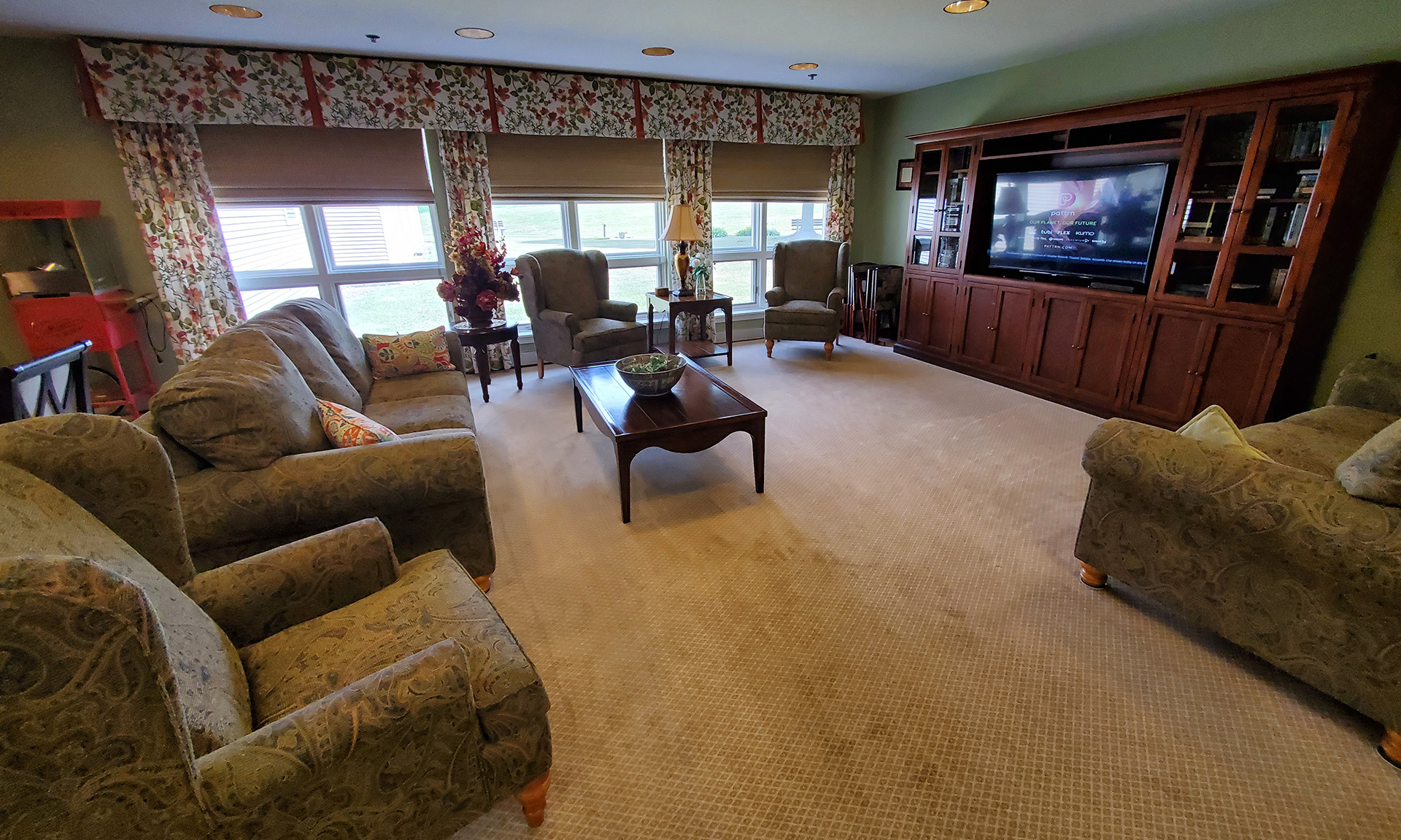 Cozy common area with comfortable seating and a TV.