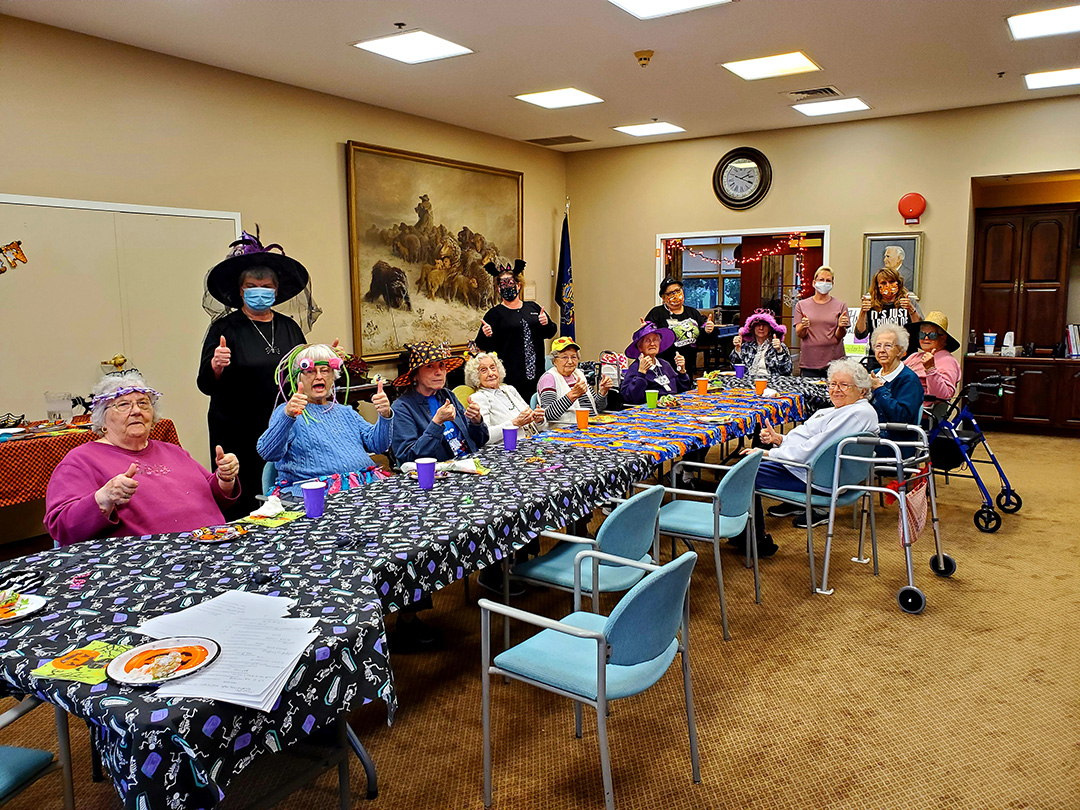 Residents enjoying a festive activity in a common area.