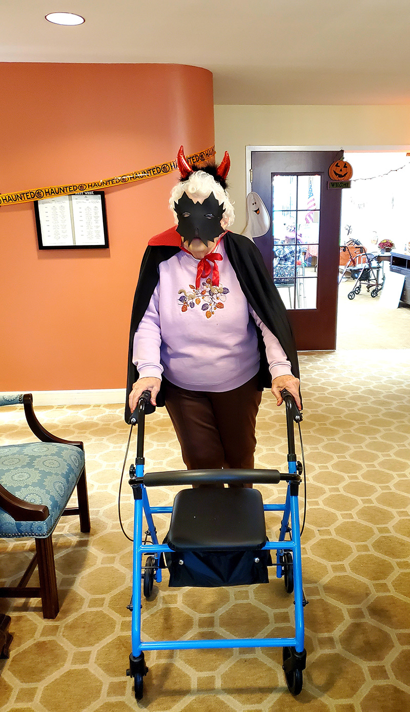 Resident dressed for Halloween in a common area.