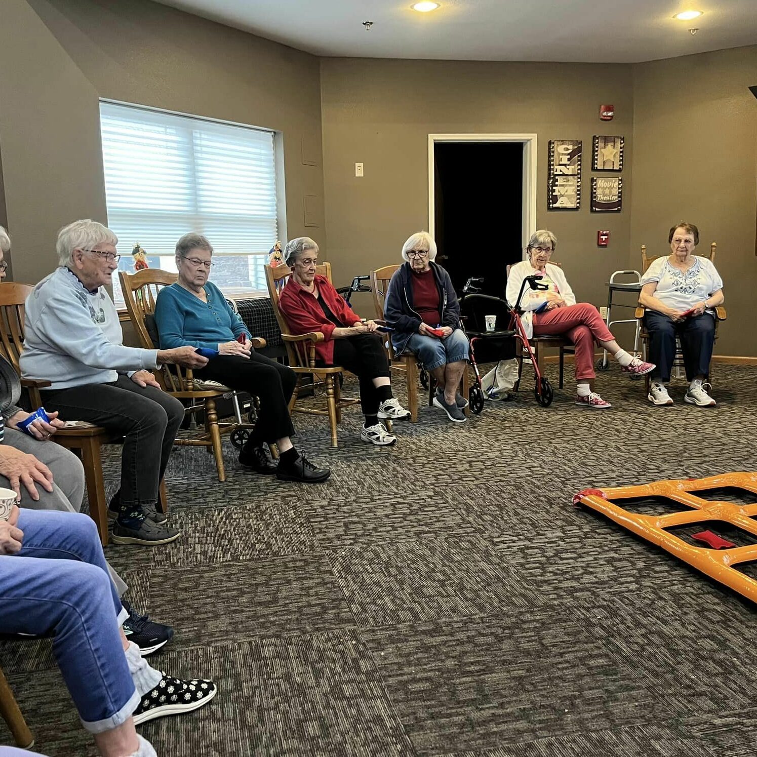 Seniors participating in a group activity indoors.
