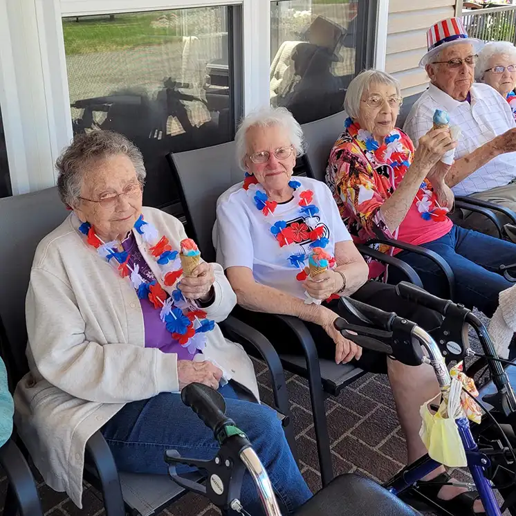 Residents enjoying ice cream outdoors at the facility.