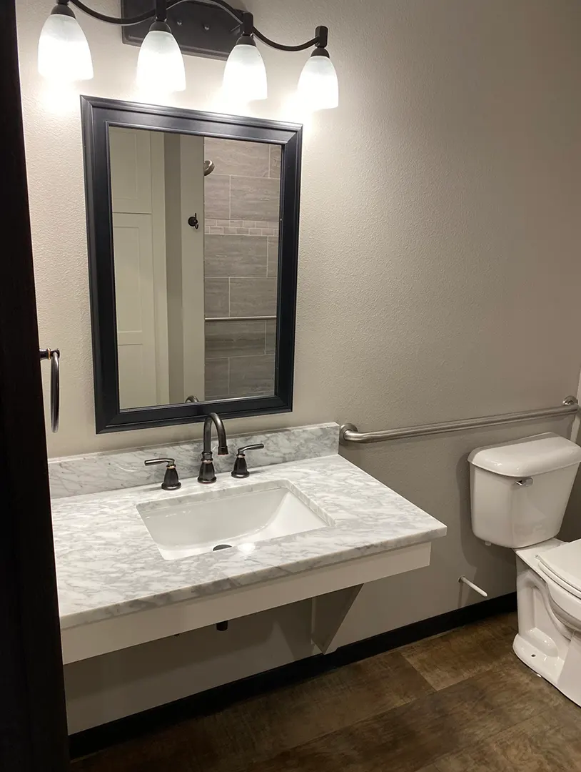 Modern bathroom with a sink and mirror.
