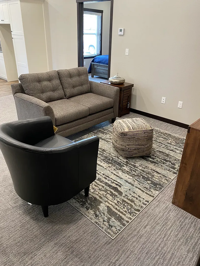 Cozy lounge area with seating and decor.