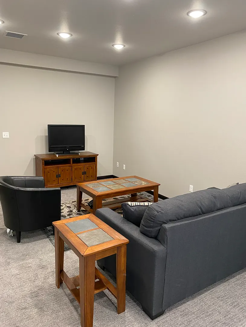 Common area with seating and television