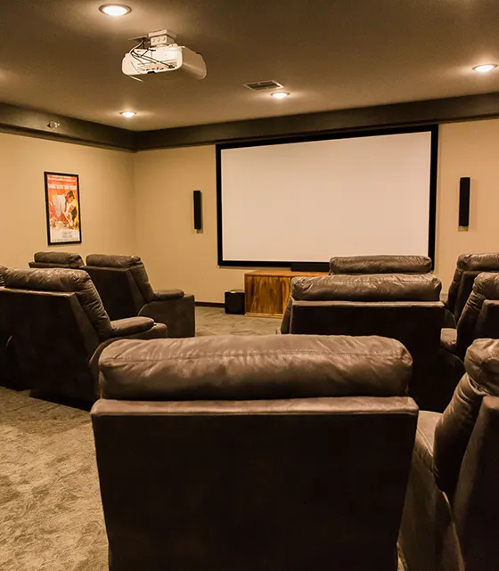 Interior of a movie theater room with seating.