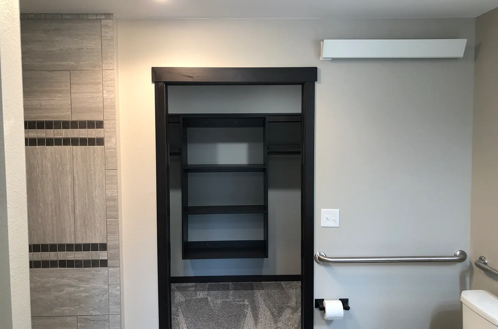 Interior view of a bathroom with a closet