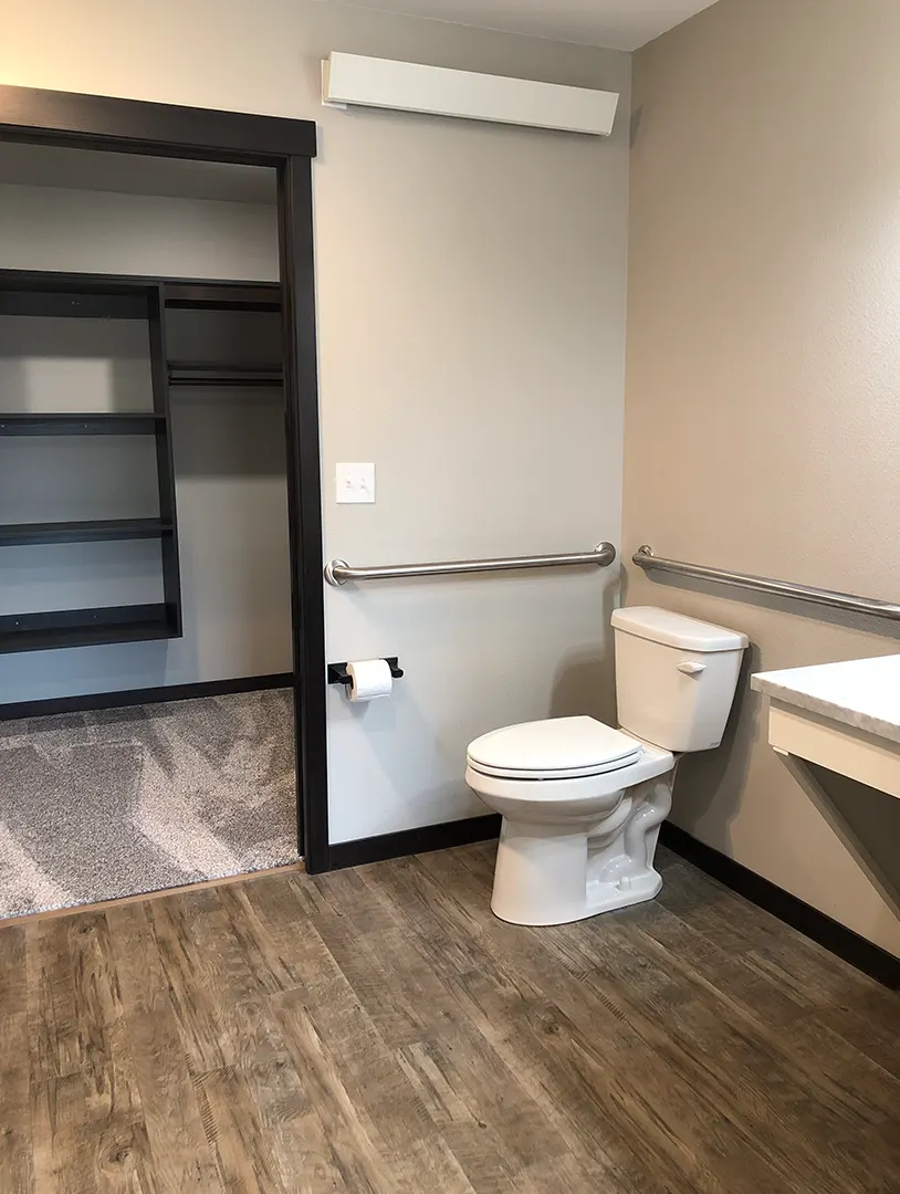 Clean and accessible bathroom with grab bars