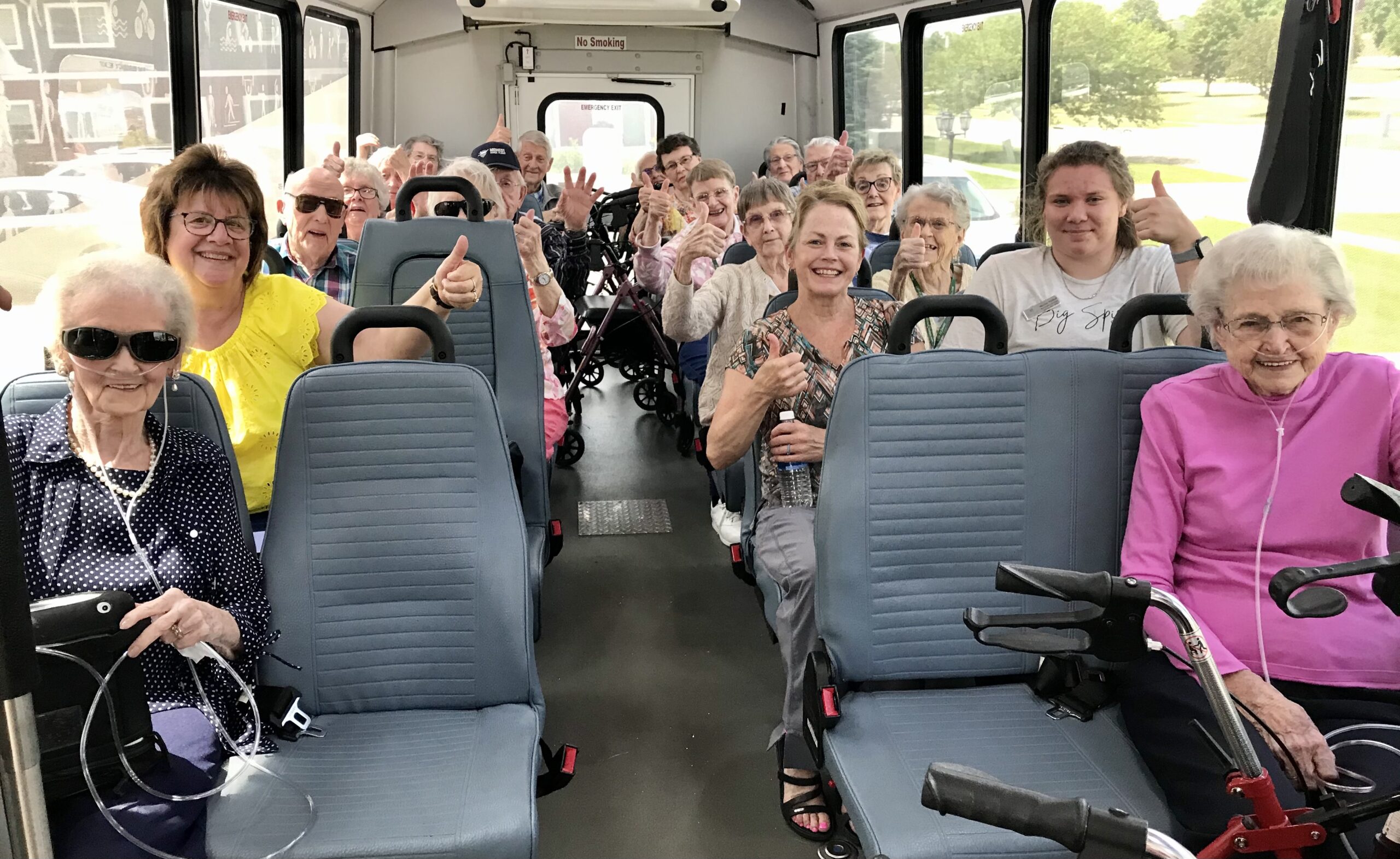 Residents enjoying a trip on a facility bus.