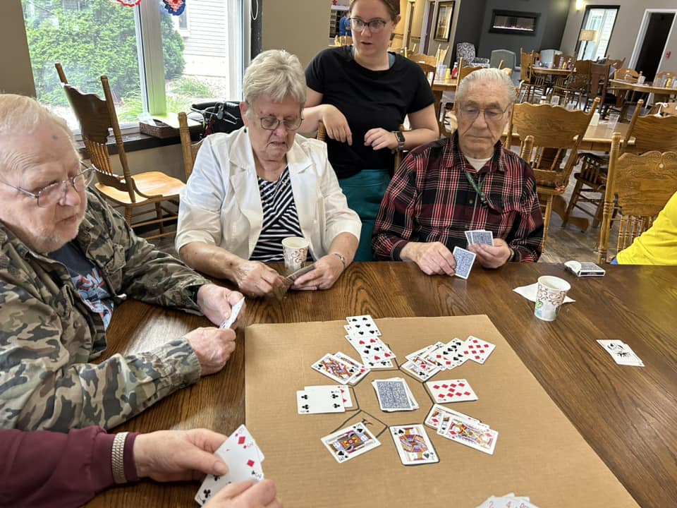 Residents enjoying a card game in common area