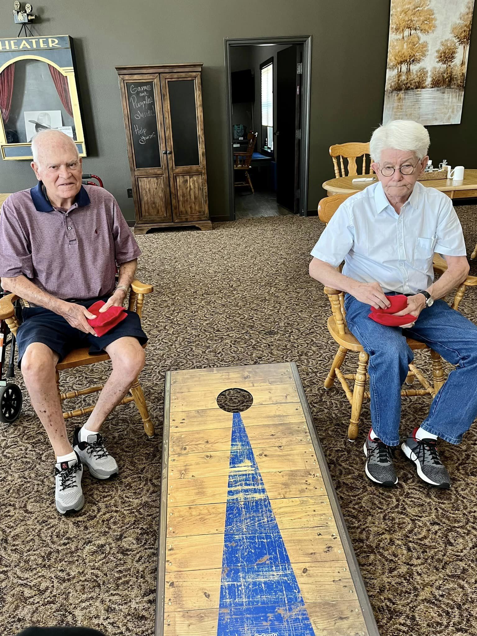 Two seniors participating in a game.