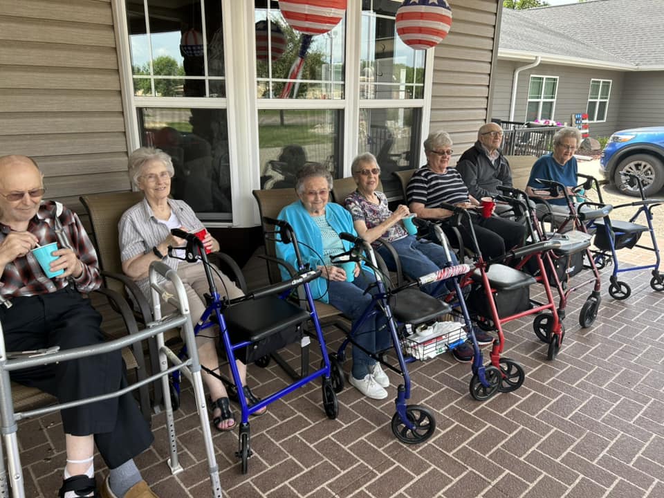 Residents enjoying drinks on the porch