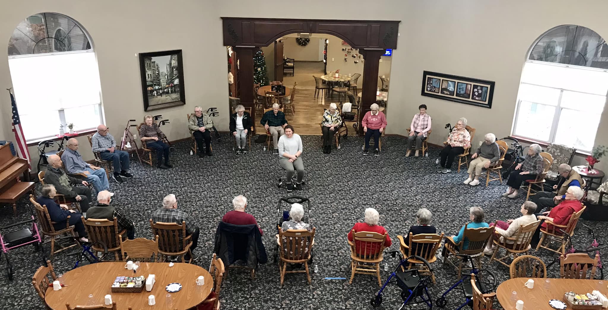 Residents and staff engaged in an activity in a common area