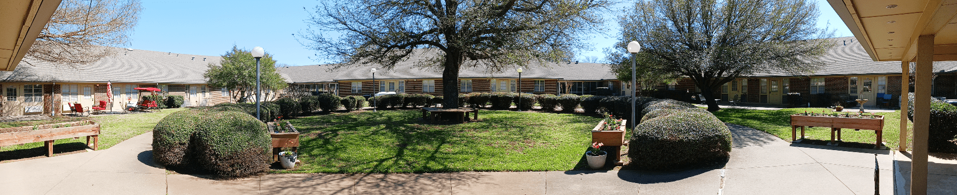 Courtyard with manicured bushes and trees