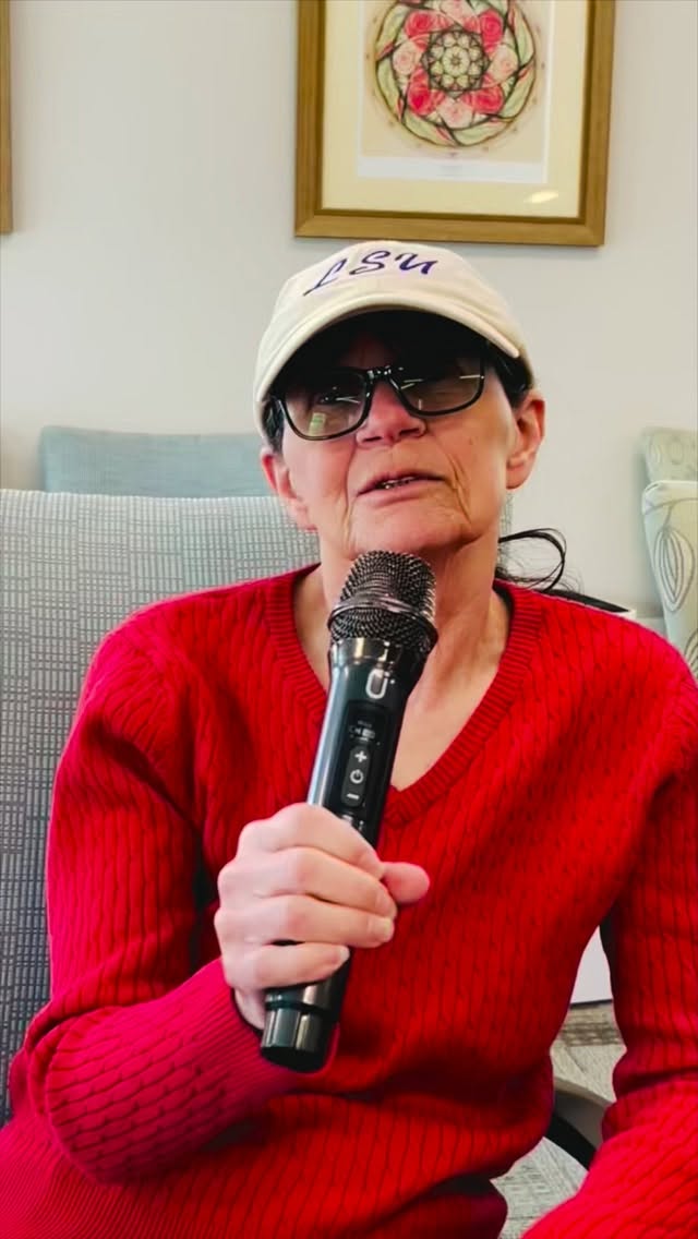 Resident enjoying karaoke in a common area.