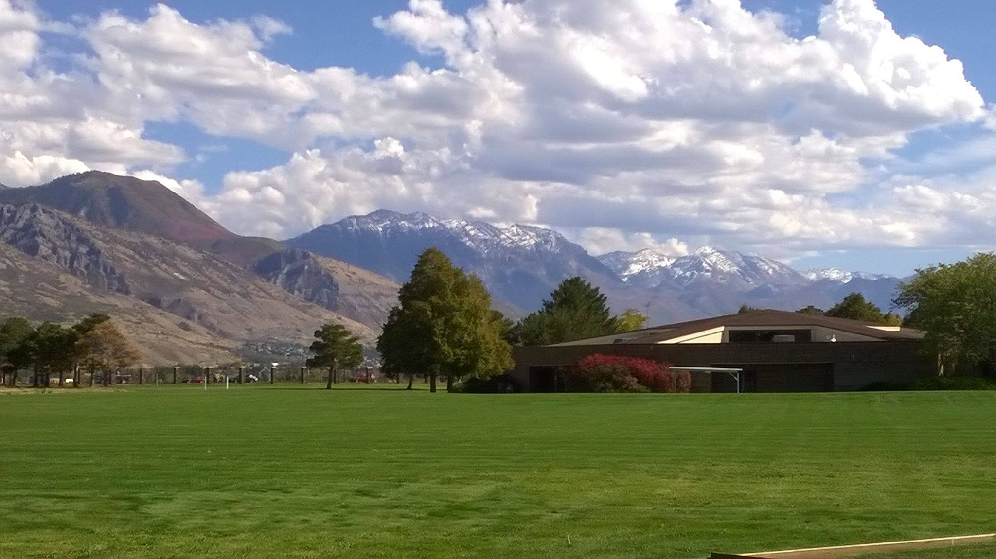 Scenic view of mountains and grass field