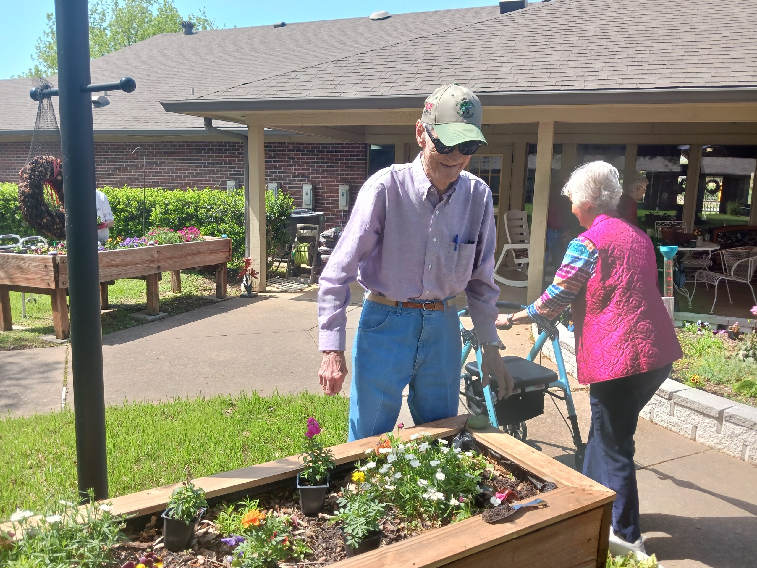 Residents gardening in an outdoor space.