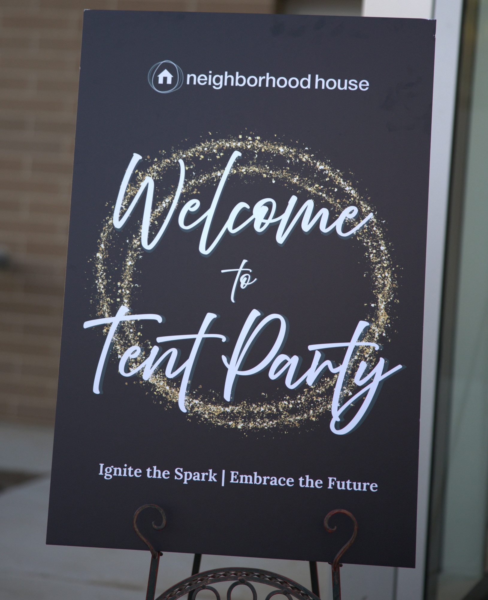Sign welcoming guests to a tent party.