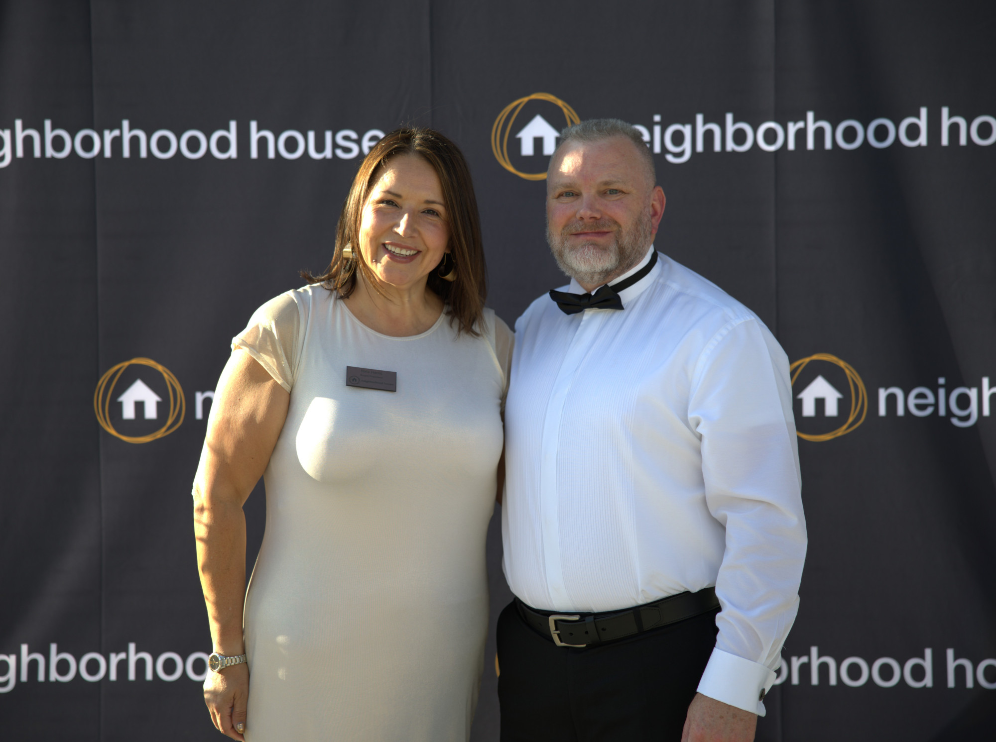Two staff members posing for a photo.