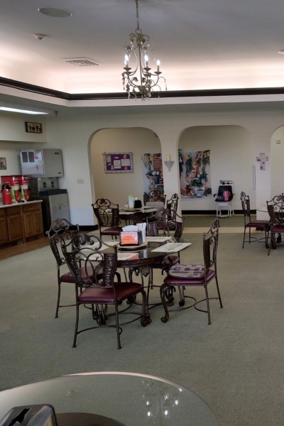 Decorated dining area with tables and chairs.